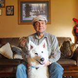 Pete Peterson posing with his dog